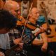 A group of people playing in the Malones Leith Irish Trad Sessions